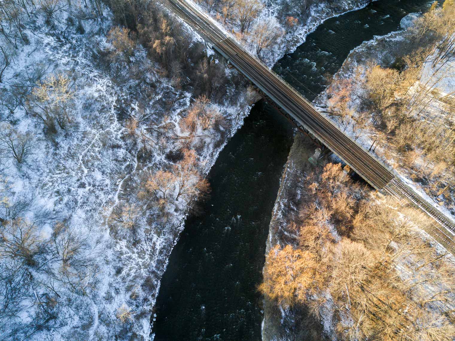 Aerial view of Streetsville Mermorial Park bridge in winter 