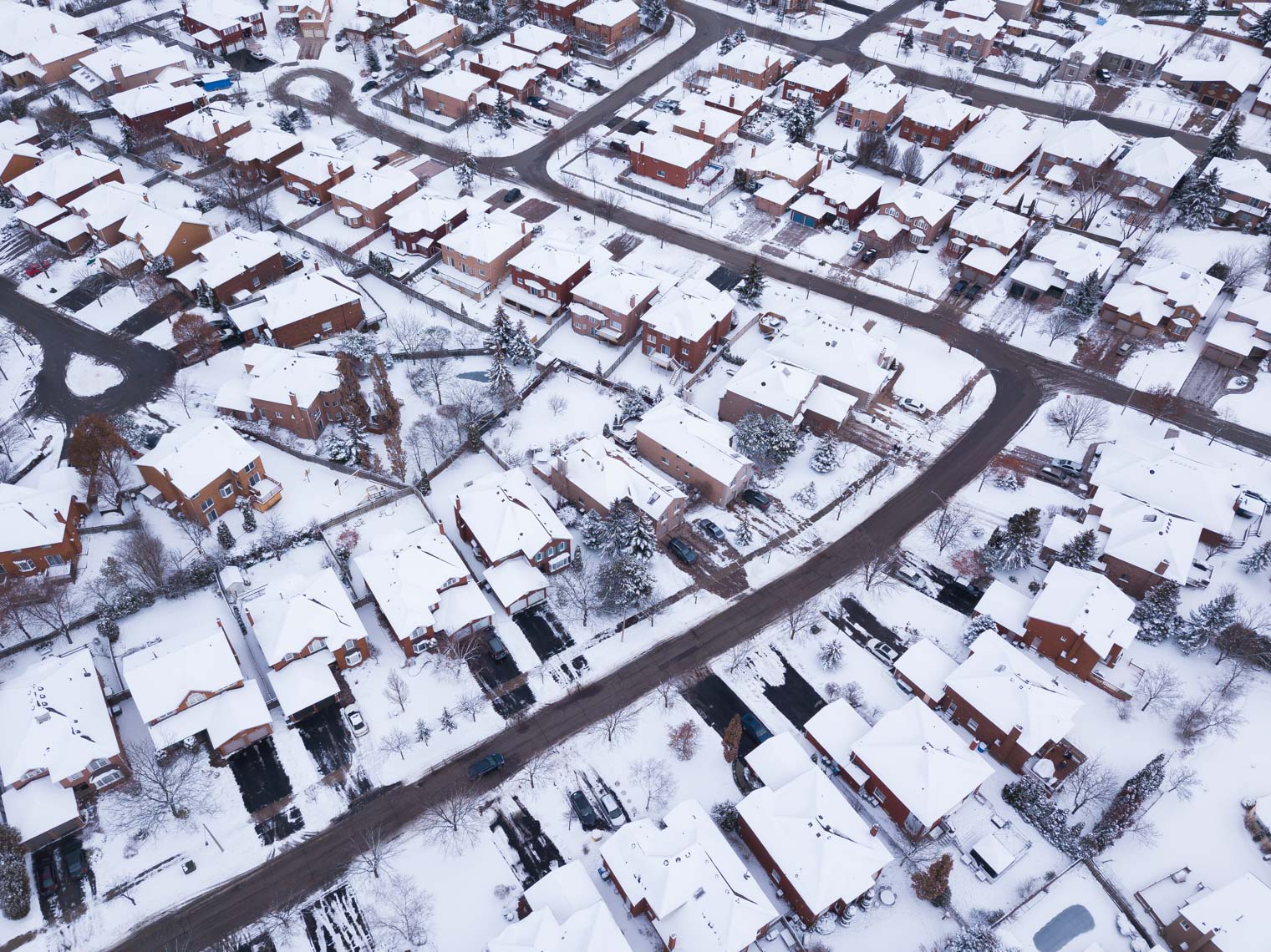 Aerial view of snowy Mississauga subdivisions in winter
