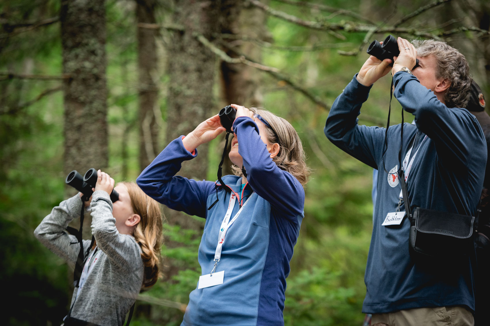 A child and her parents looking through binoculars in Blue Mountain-Birch Cove Lakes Wilderness Area